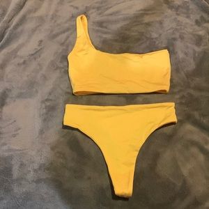Cute swimsuit with very cheeky bottoms.